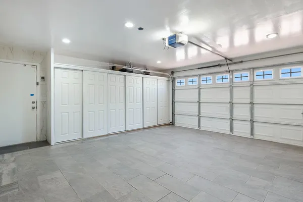 a large kitchen with cabinets and stainless steel appliances