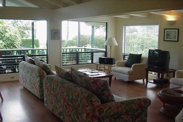 4386 Hee Road Hanalei, HI 96714 - Photo 13 of 28 a living room with furniture and a large window