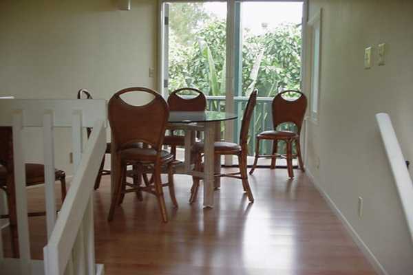 4386 Hee Road Hanalei, HI 96714 - Photo 14 of 28 a view of a dining room with furniture window and wooden floor