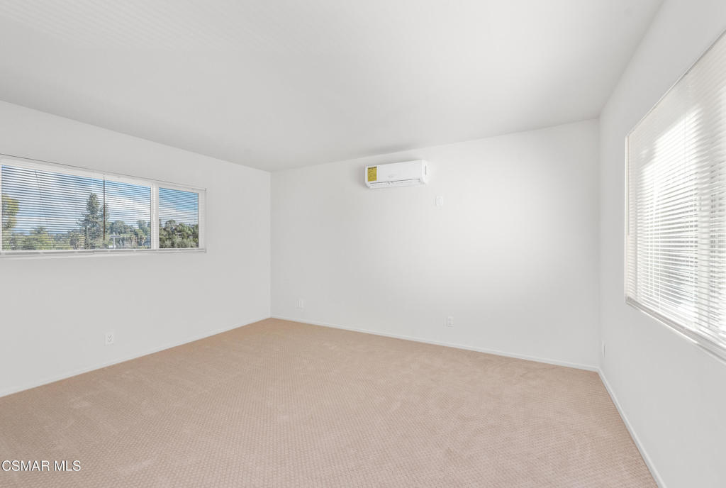 22002 Ybarra Road Woodland Hills, CA 91364 - Photo 13 of 31 an empty room with windows
