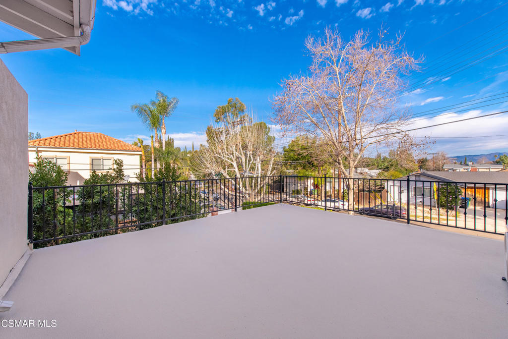 22002 Ybarra Road Woodland Hills, CA 91364 - Photo 27 of 31 a view of a city street from a balcony