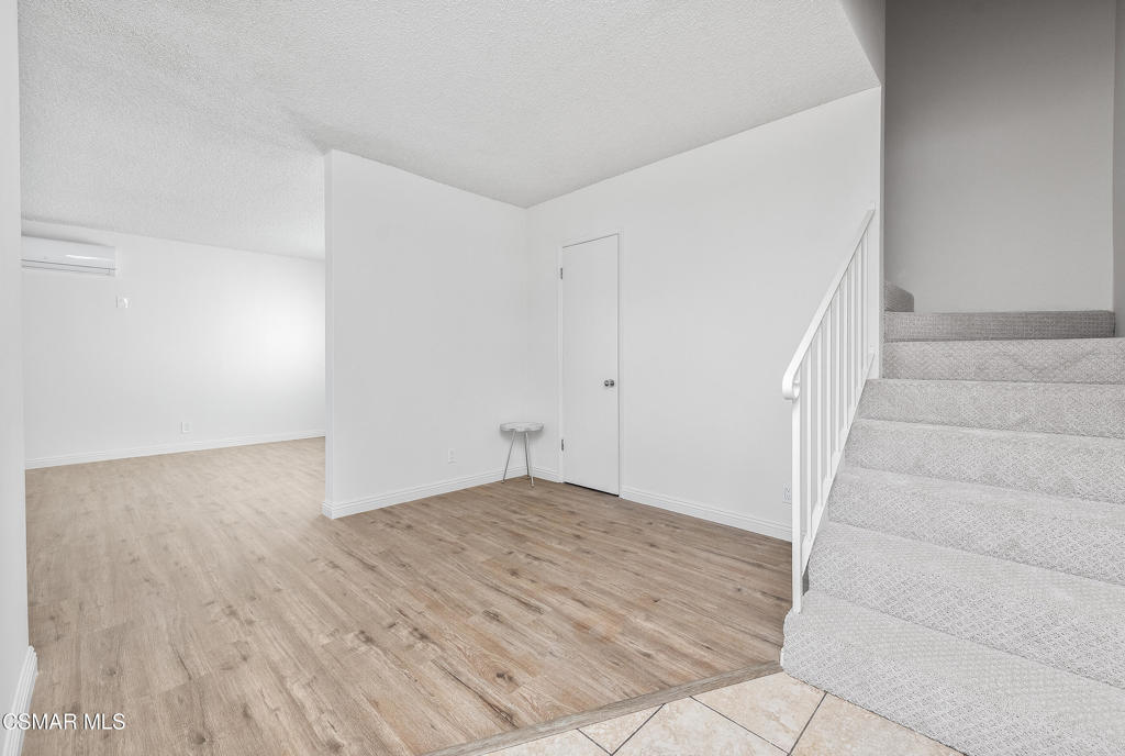 22002 Ybarra Road Woodland Hills, CA 91364 - Photo 7 of 31 a view of an empty room with stairs