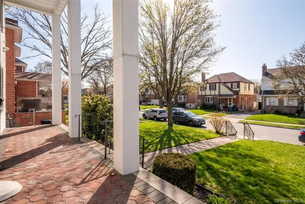 a view of house with yard in front of house