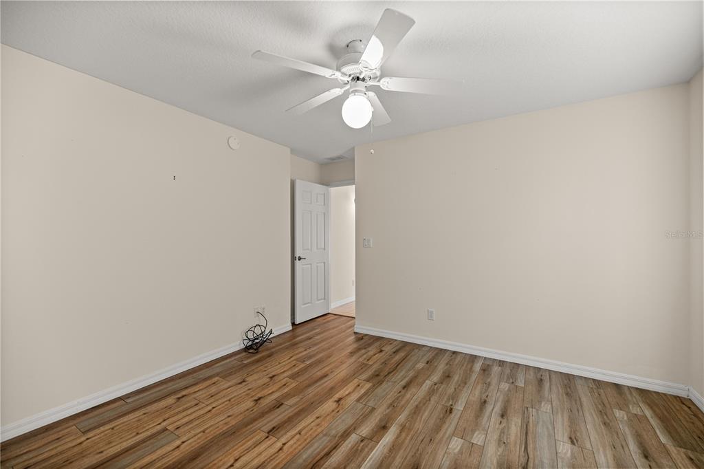8601 Southwest 60th Circle Ocala, FL 34476 - Photo 14 of 37 wooden floor in an empty room