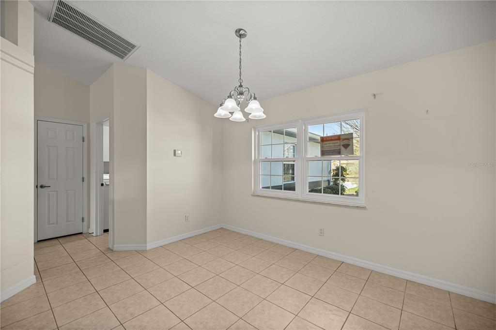 8601 Southwest 60th Circle Ocala, FL 34476 - Photo 15 of 37 a view of a room with window and chandelier