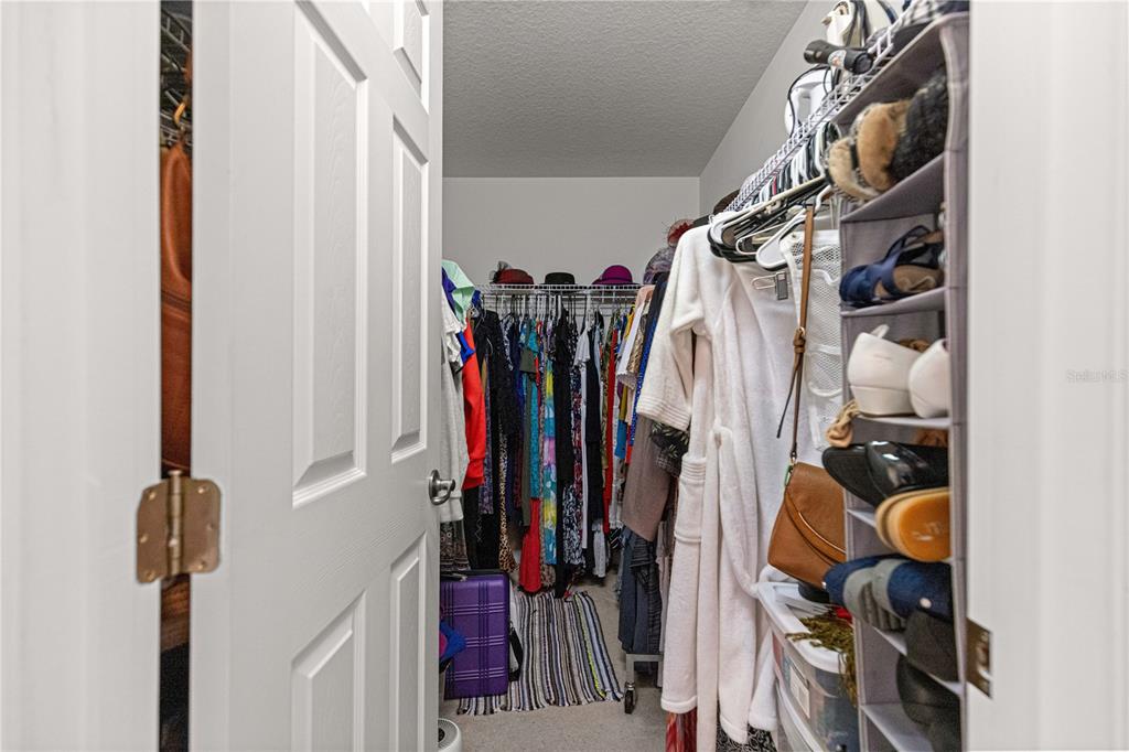 8601 Southwest 60th Circle Ocala, FL 34476 - Photo 19 of 45 a view of walk in closet with clothes and shoes