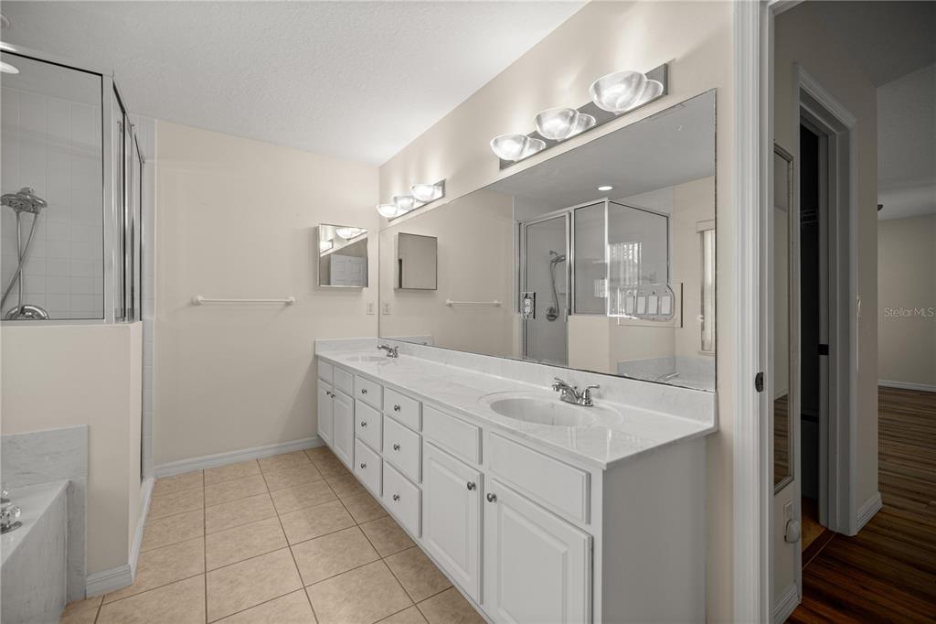 8601 Southwest 60th Circle Ocala, FL 34476 - Photo 20 of 37 a bathroom with a double vanity sink and mirror