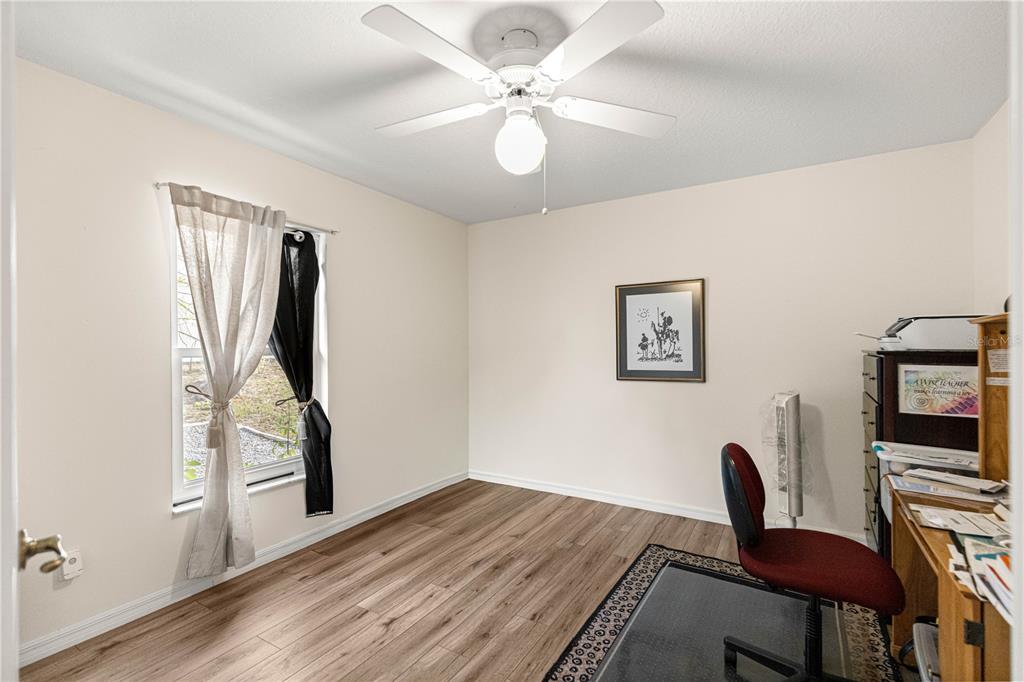 8601 Southwest 60th Circle Ocala, FL 34476 - Photo 22 of 45 a view of a workspace with furniture and a window
