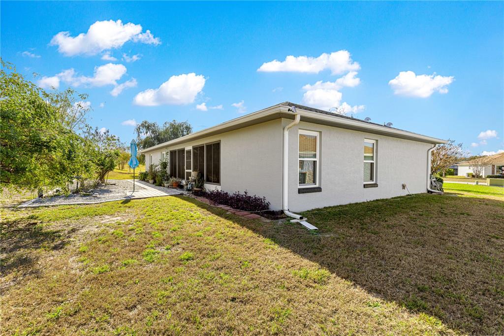 8601 Southwest 60th Circle Ocala, FL 34476 - Photo 24 of 37 a view of a house with backyard and sitting area