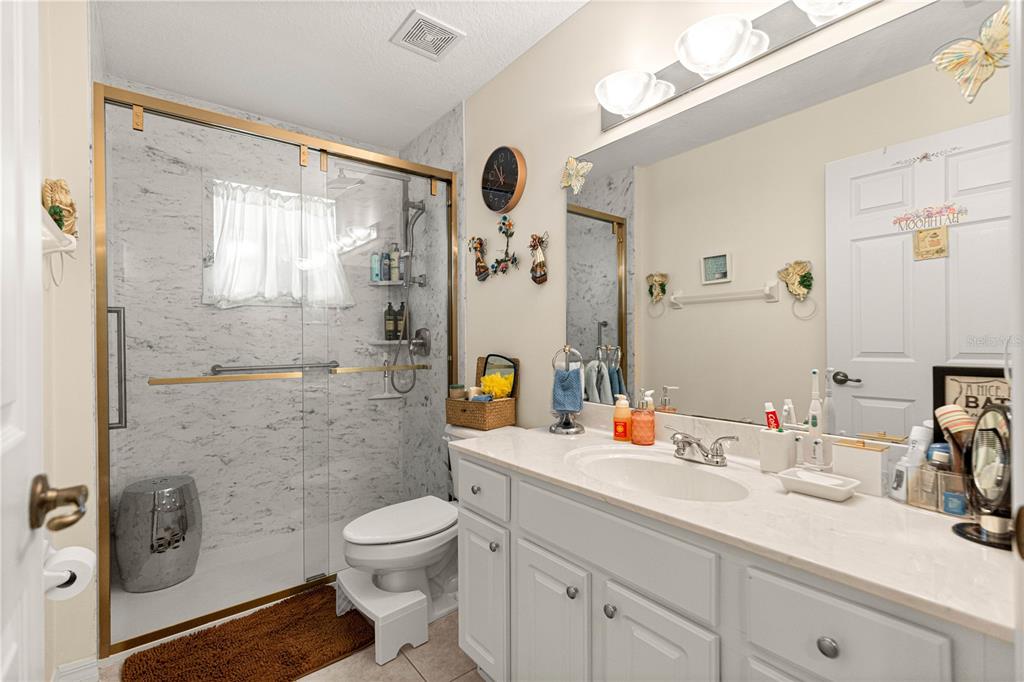 8601 Southwest 60th Circle Ocala, FL 34476 - Photo 26 of 45 a bathroom with a sink toilet tub and shower
