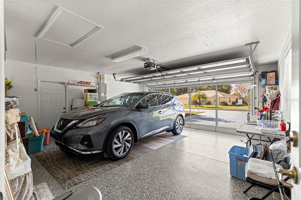 8601 Southwest 60th Circle Ocala, FL 34476 - Photo 34 of 45 a car that is parked in a garage