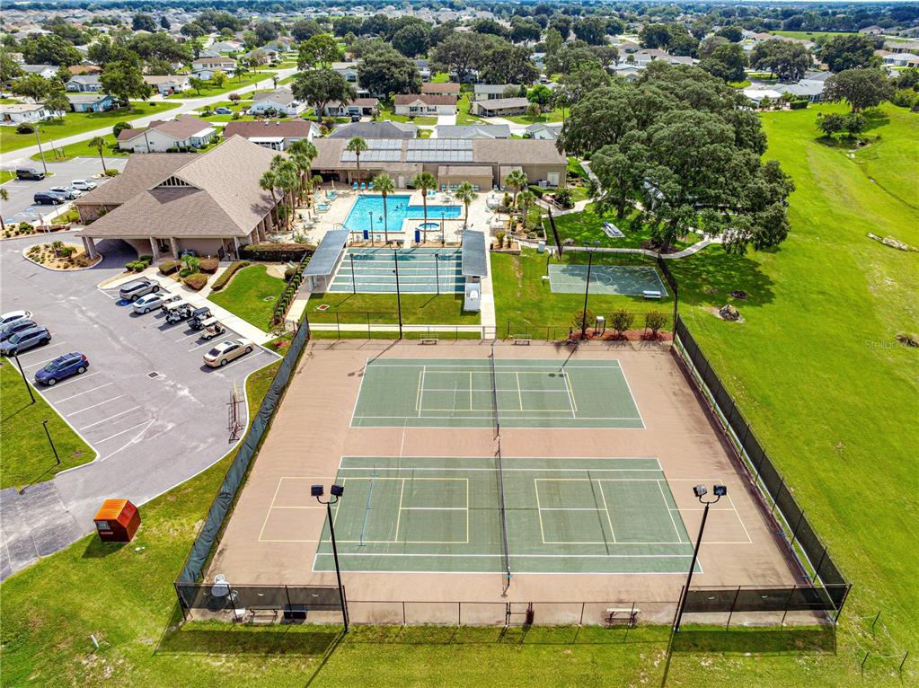 8601 Southwest 60th Circle Ocala, FL 34476 - Photo 41 of 45 an aerial view of a tennis ground with large trees