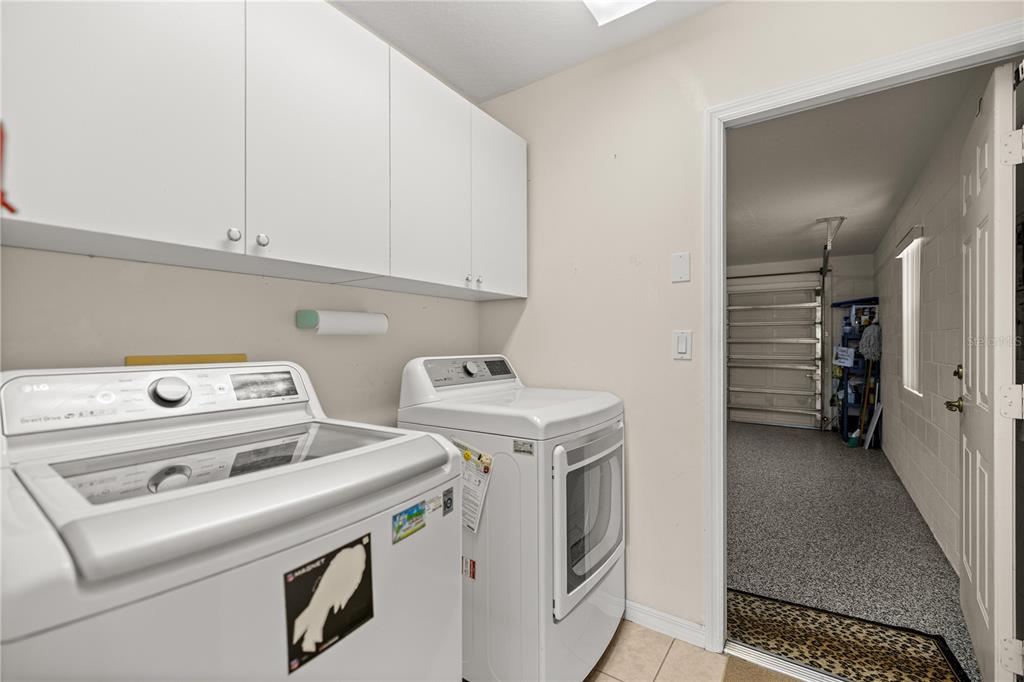 8601 Southwest 60th Circle Ocala, FL 34476 - Photo 8 of 37 a utility room with dryer and washer
