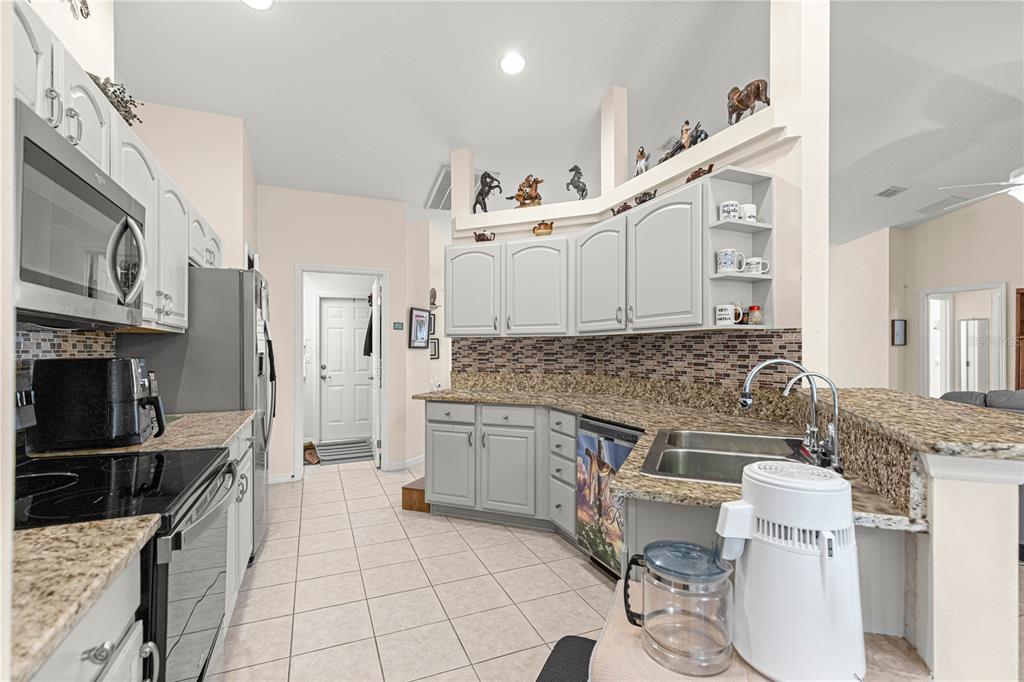 8601 Southwest 60th Circle Ocala, FL 34476 - Photo 9 of 45 a kitchen with a sink appliances and cabinets