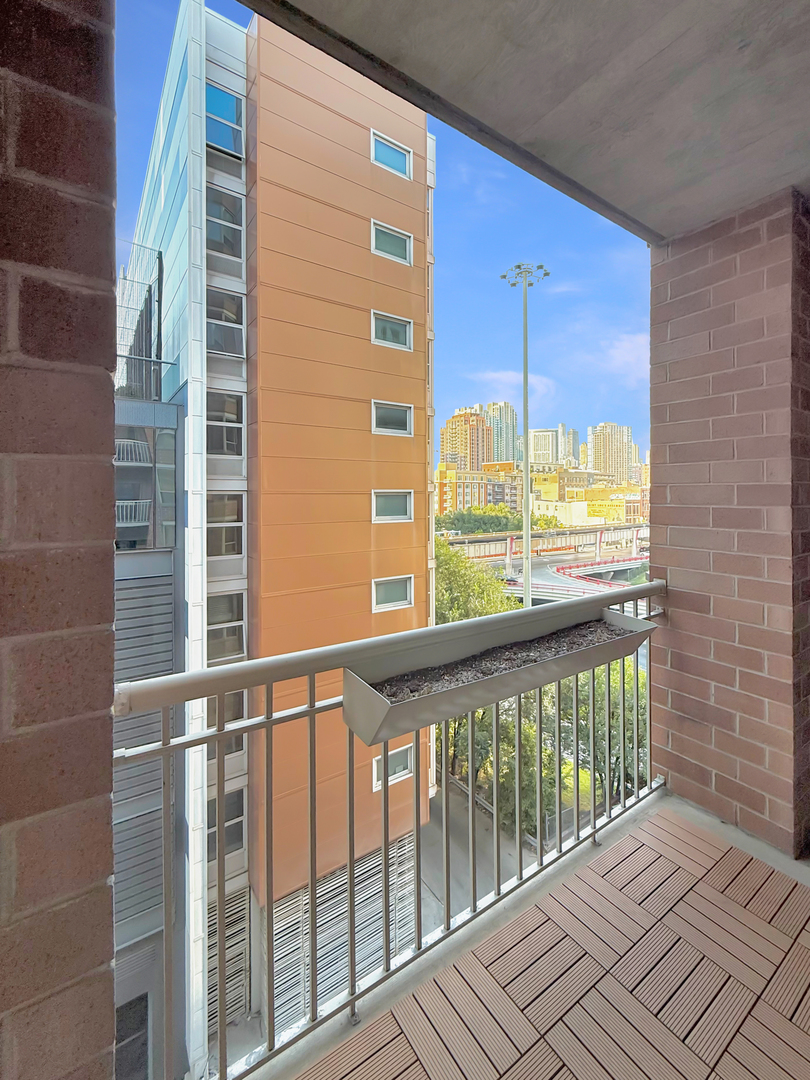720 West Randolph Street, Unit 608 Chicago, IL 60661 - Photo 32 of 40 a view of a balcony with a floor to ceiling window