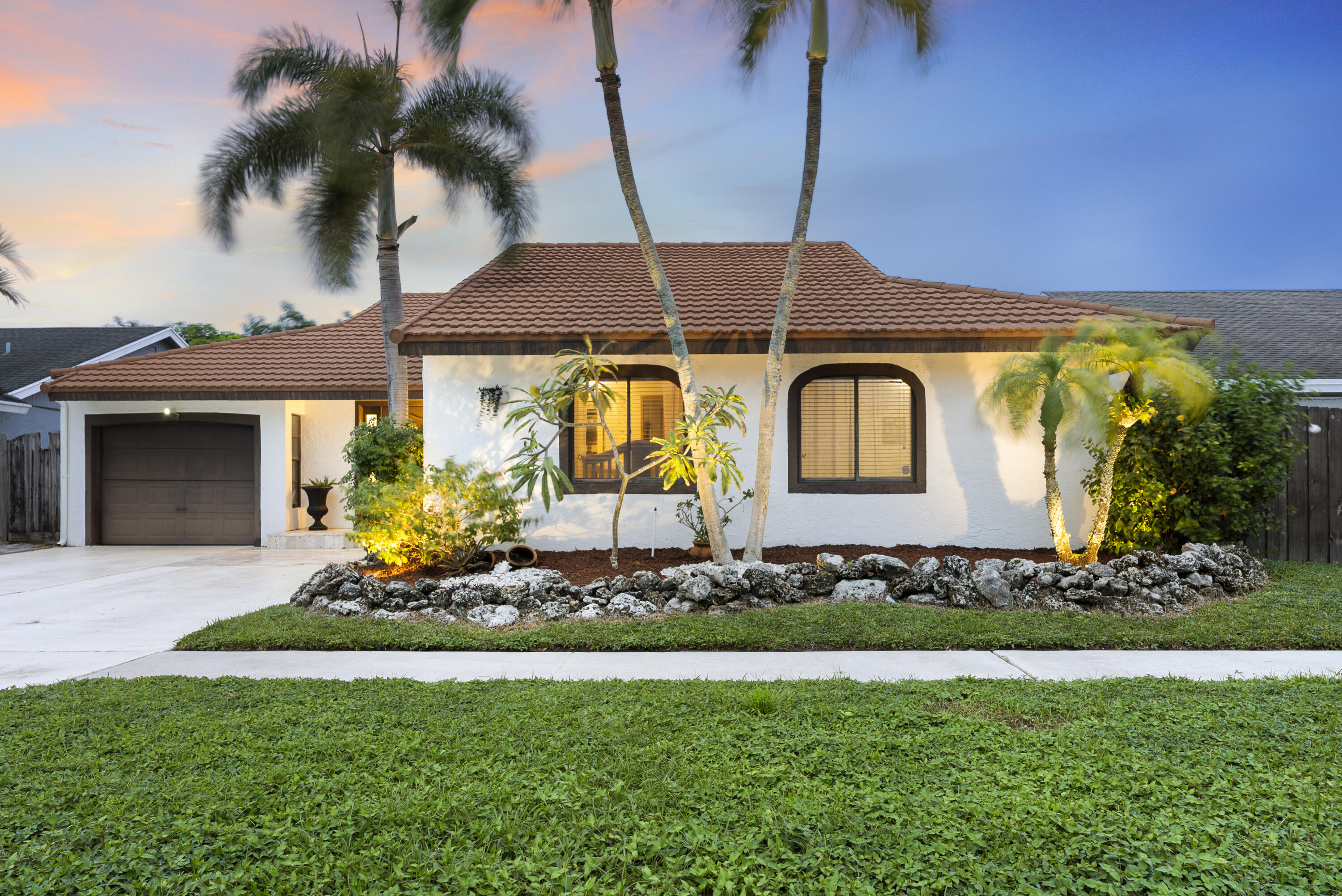 11627 Countryview Lane Boca Raton, FL 33428 - Photo 39 of 44 a front view of a house with a garden