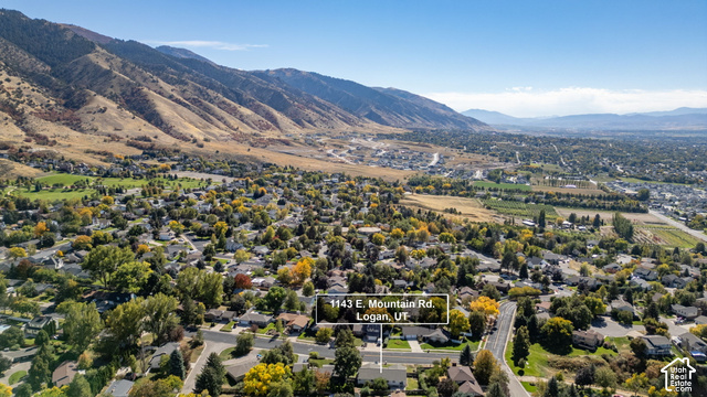 1143 East Mountain Road Logan, UT 84321 - Photo 53 of 64 Expansive aerial perspective showcasing a residential neighborhood with surrounding mountains and a visible street grid
