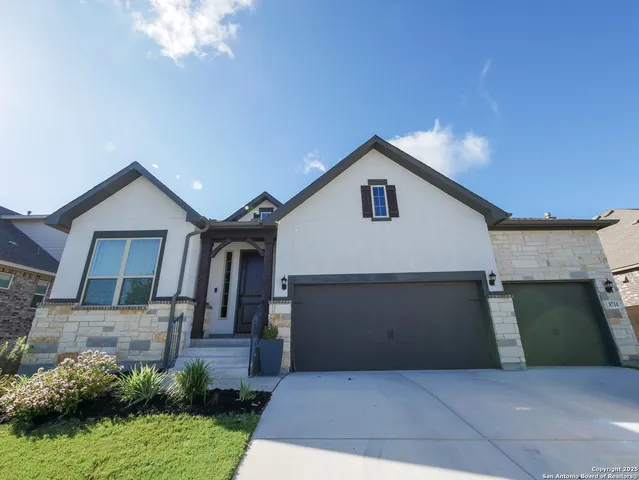 a front view of a house with garage