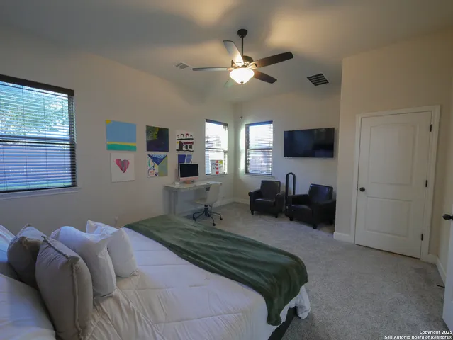 a bathroom with a sink mirror and toilet