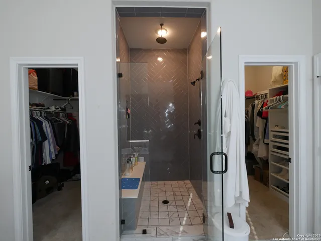 a bed room with a bed and a chair