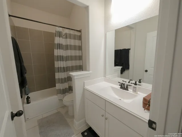 a room with a wooden floor and a window