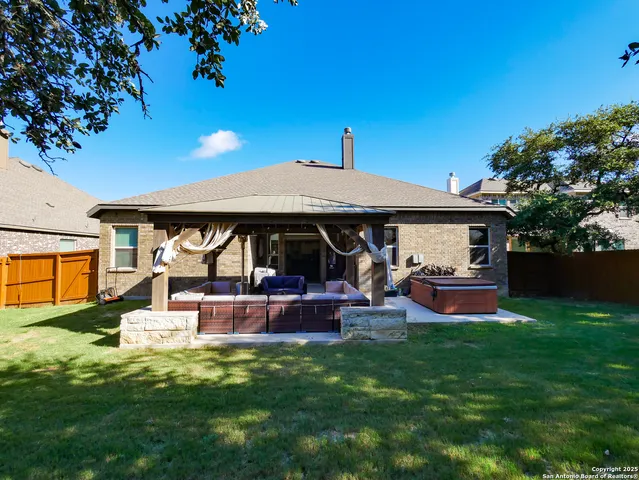 a view of a patio with couches chairs and a potted plant