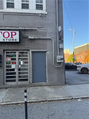 a front view of a building with a garage