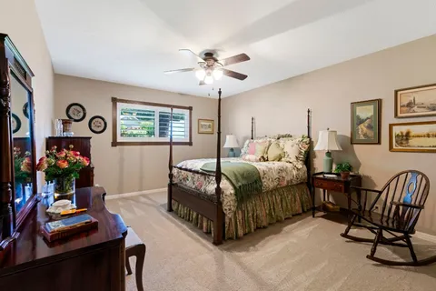 a bedroom with bed and a window