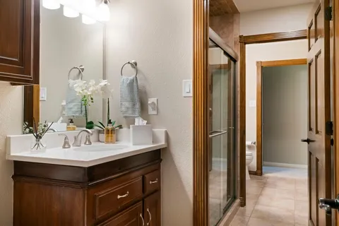 a bathroom with a sink vanity and a mirror