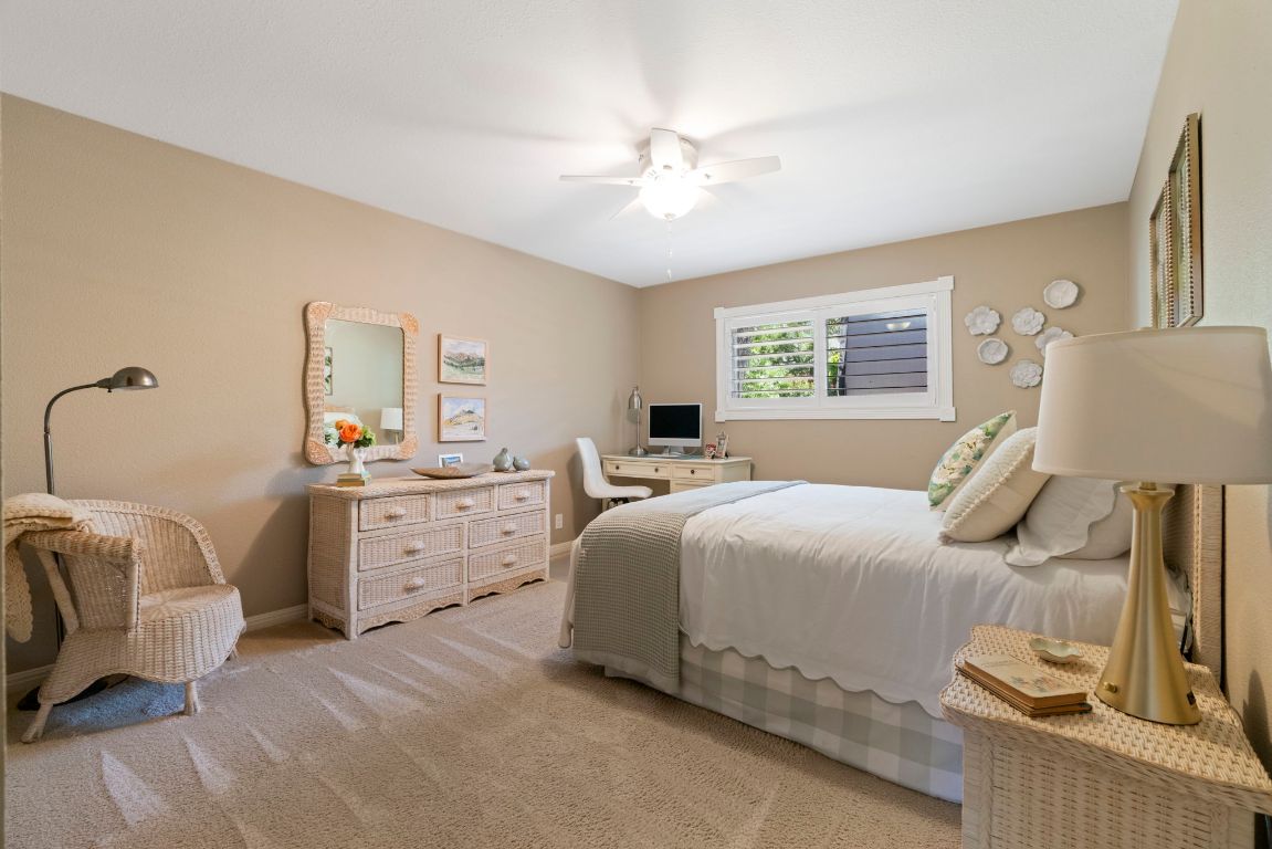 2911 Gabriel View Drive Georgetown, TX 78628 - Photo 18 of 39 a bedroom with a bed and a chandelier