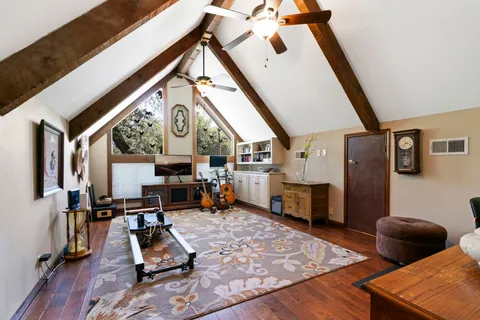 a view of a livingroom with furniture and a flat screen tv