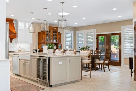 a view of a kitchen and dining table chairs