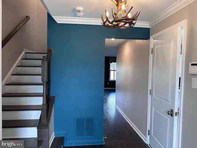 a view of livingroom with hardwood floor and hallway