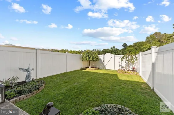 a view of a yard with an outdoor space