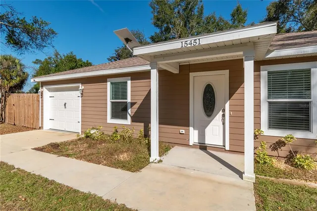 a front view of a house with a garage