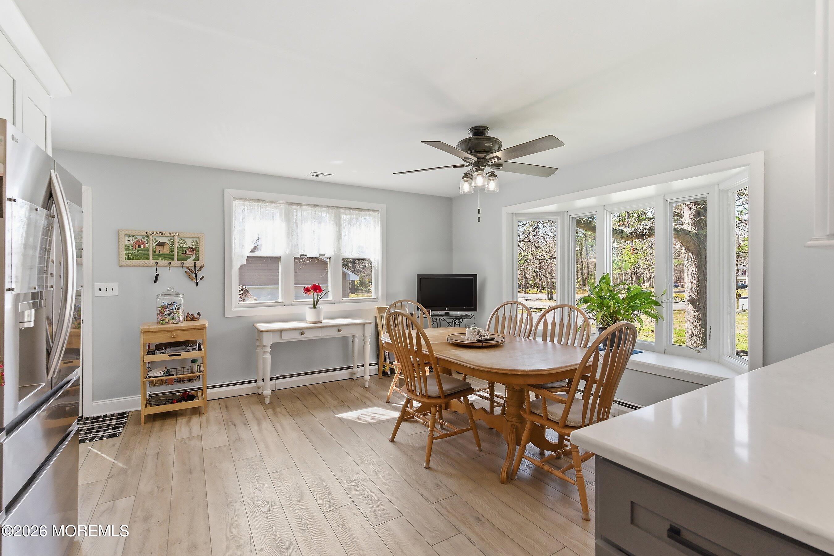 745 Oak Glen Road Howell, NJ 07731 - Photo 13 of 46 a workspace with furniture window and wooden floor