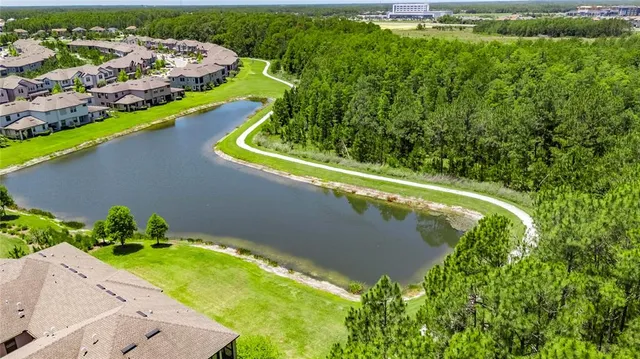 an aerial view of a house with a garden