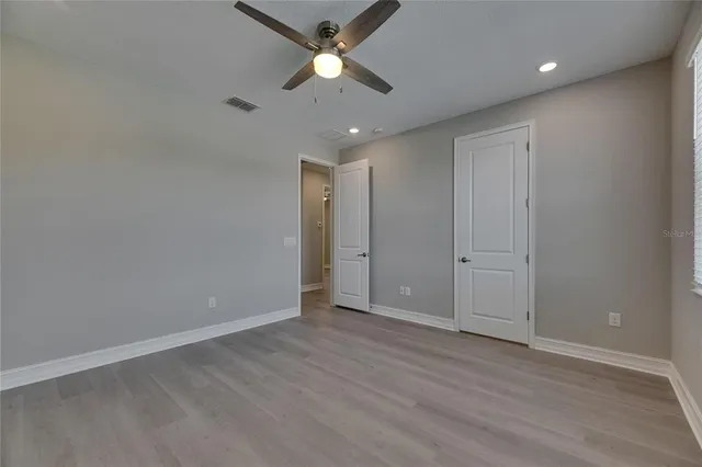 an aerial view of a house with a yard lake view