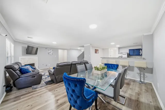 a living room with furniture and kitchen view