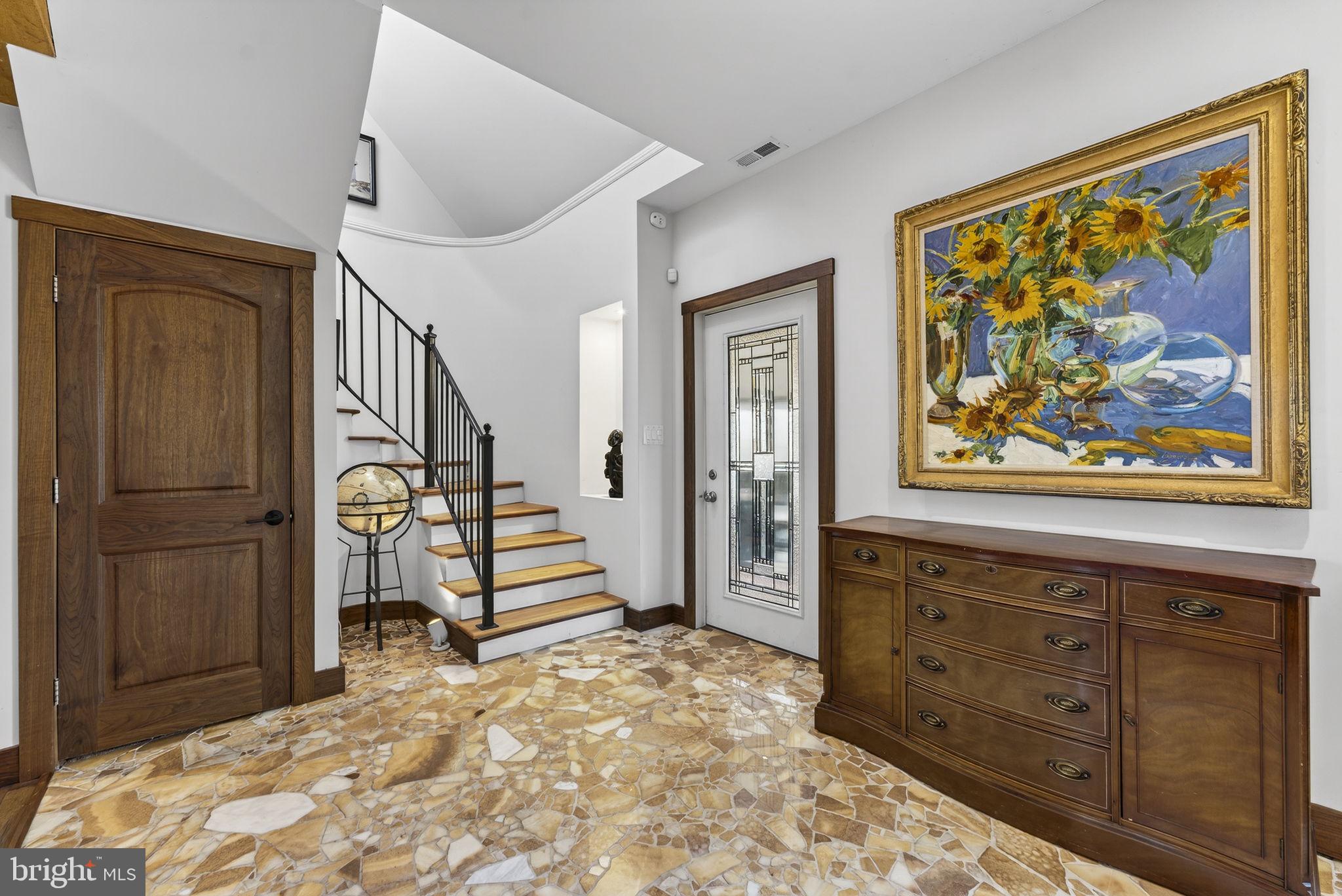 40 Angel Kiss Lane Castleton, VA 22716 - Photo 13 of 56 Curved staircase to the upper level primary suite