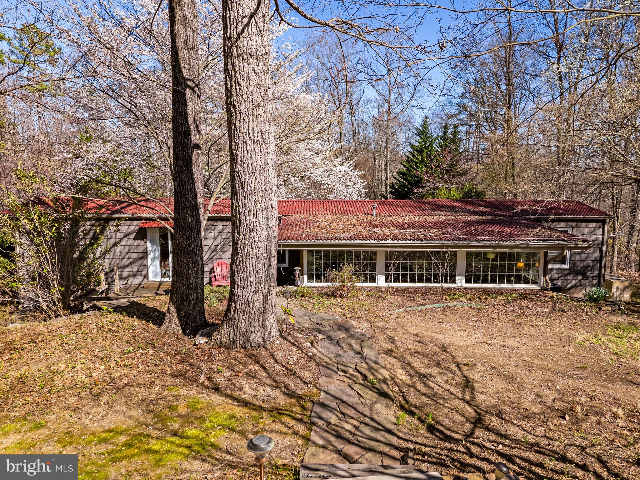 40 Angel Kiss Lane Castleton, VA 22716 - Photo 44 of 56 The partial berm and metal roof of the cottage