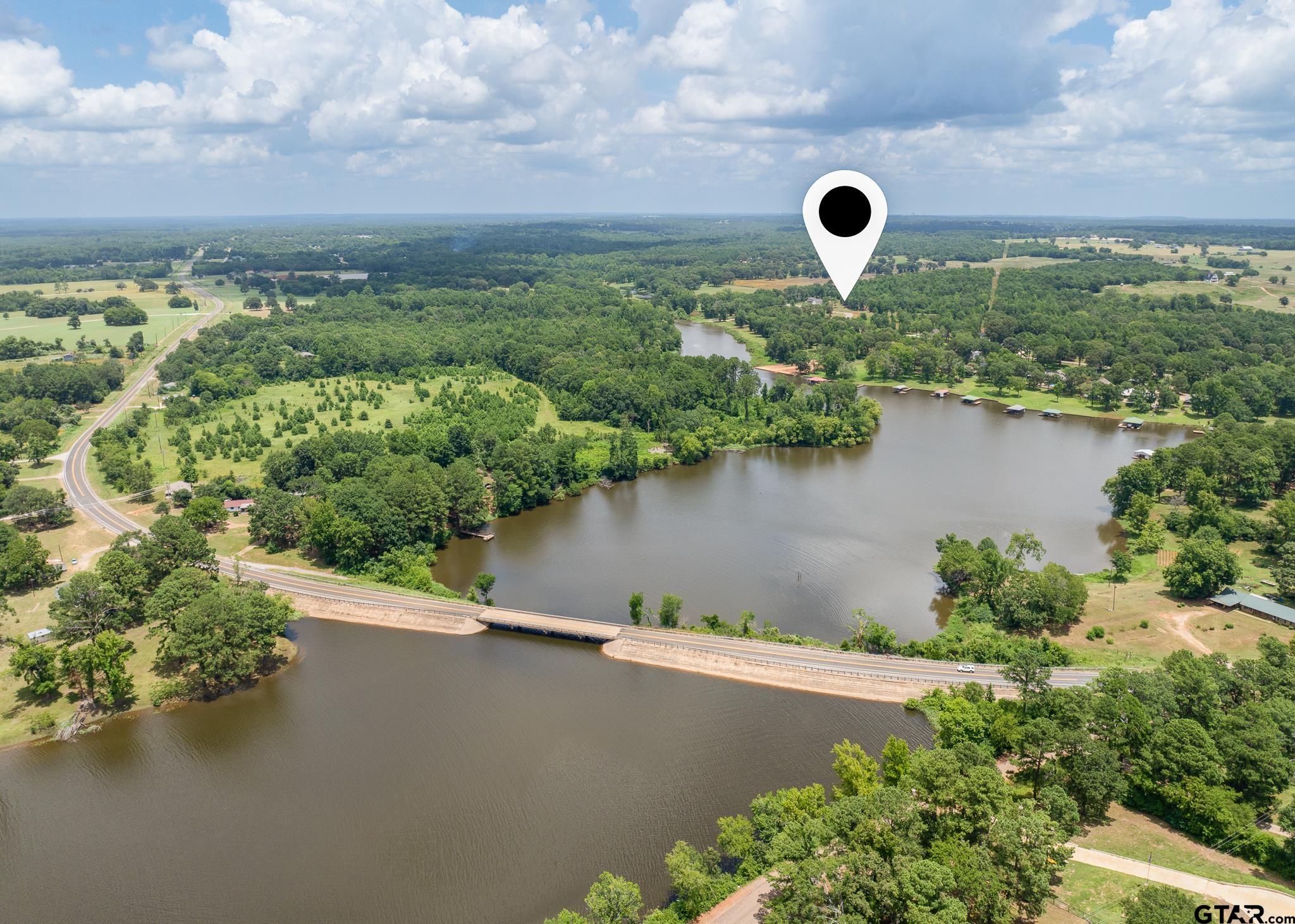 765 Stone Chimney Road Bullard, TX 75757 - Photo 5 of 7 an aerial view of a house with a yard and lake view