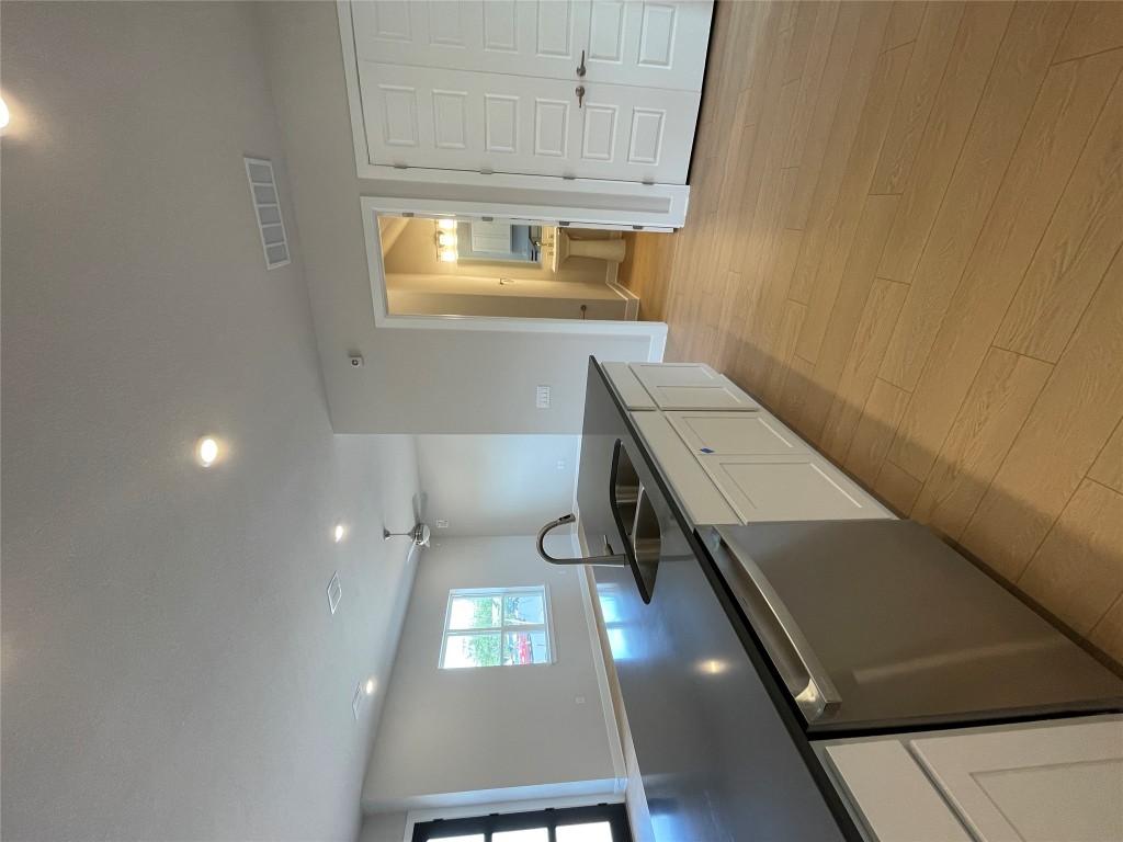 4701 Wally Avenue, Unit A Austin, TX 78721 - Photo 11 of 35 a large kitchen with cabinets and a sink