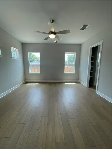a view of room window and wooden floor