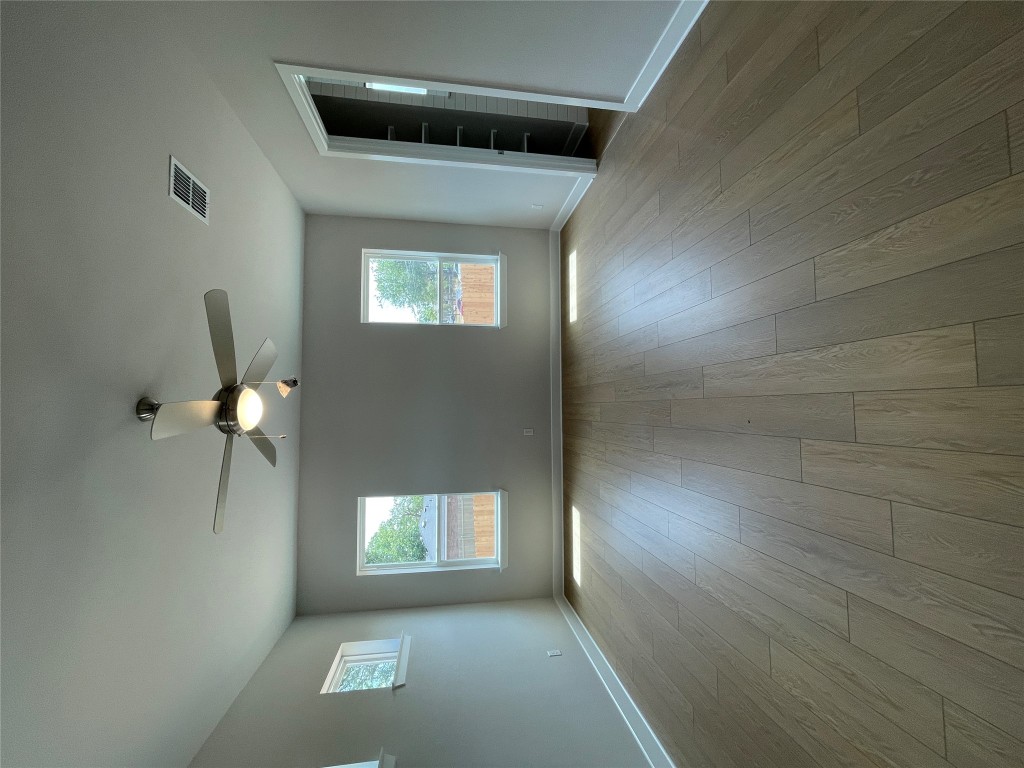 4701 Wally Avenue, Unit A Austin, TX 78721 - Photo 12 of 35 a view of room window and wooden floor