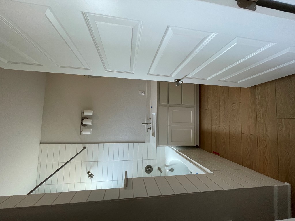 4701 Wally Avenue, Unit A Austin, TX 78721 - Photo 15 of 35 a bathroom with a tub a sink and a mirror