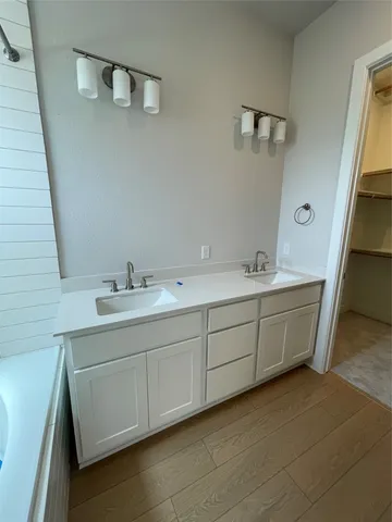 a utility room with sink dryer and washer
