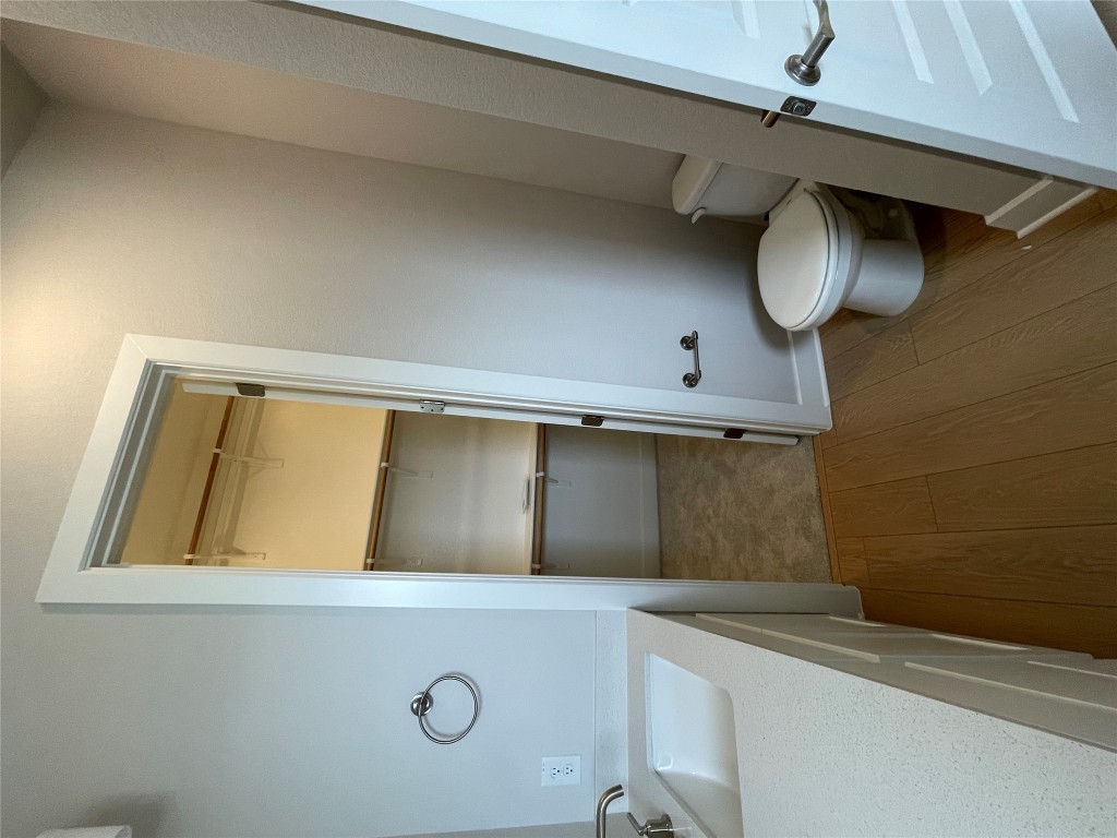 4701 Wally Avenue, Unit A Austin, TX 78721 - Photo 18 of 35 a bathroom with a sink and a toilet