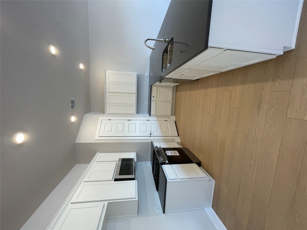 4701 Wally Avenue, Unit A Austin, TX 78721 - Photo 2 of 35 a large kitchen with a large counter top stainless steel appliances and cabinets