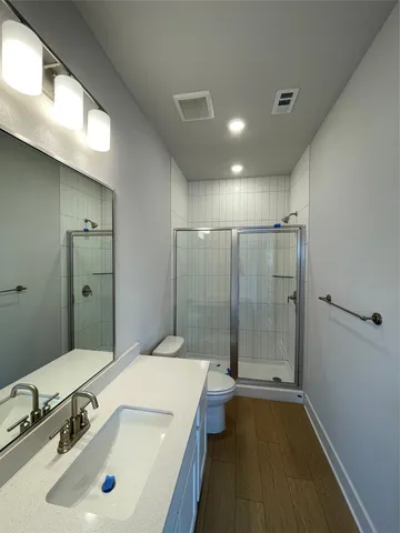 a bathroom with a sink a mirror and a bathtub